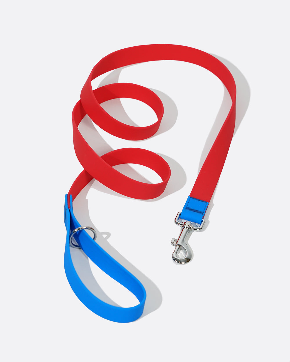 A durable and waterproof dog leash designed for outdoor adventures, with a 360° Rotating Metal Clasp, red with blue color match